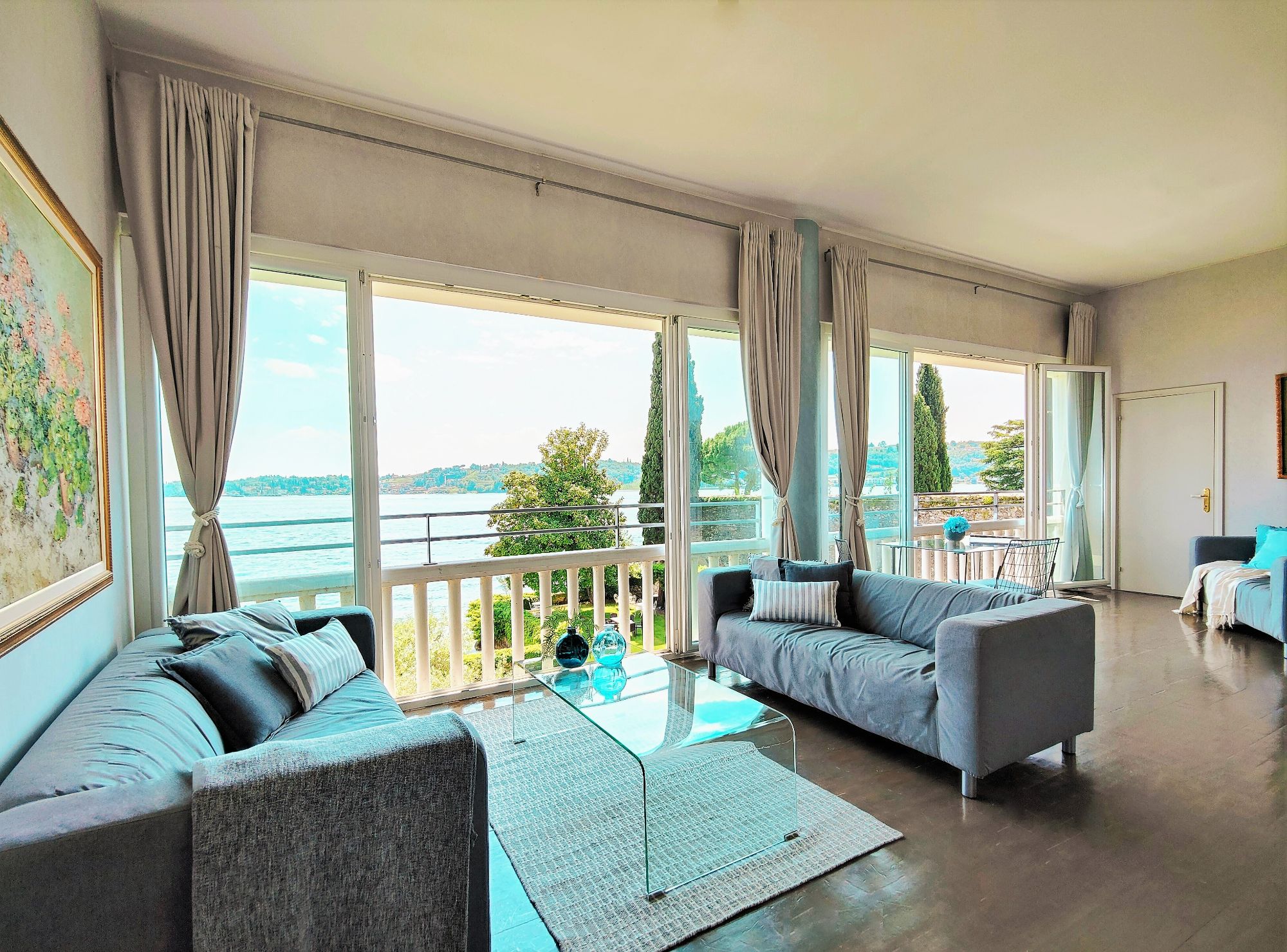Large room with sofas and beach views